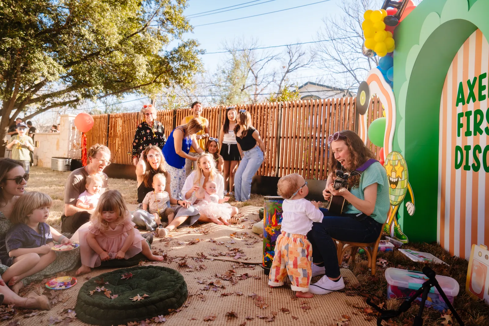 Amber performing for families at a disco-themed birthday party